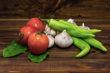 Set of fresh vegetables isolated on wood table background. Still life photography. (Selective focus)
