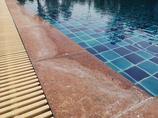 swimming pool in the hotel. Dried chlorine stains on marble surfaces near the swimming pool.