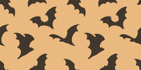 Seamless Halloween pattern with flying black bats on a warm beige background. Flat vector design perfect for spooky fabric, wrapping paper, and seasonal decoration.