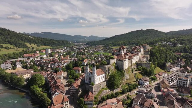 aerial - historic town of Aarburg with hilltop fortress and Aare River in canton Solothurn Switzerland