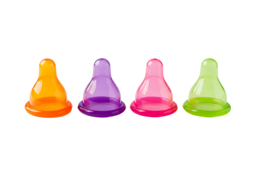 Four colorful baby bottle nipples isolated on transparent background