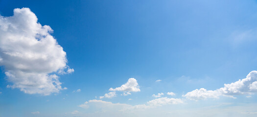 A Breath of Fresh Air: Expansive Blue Sky with Fluffy White Clouds