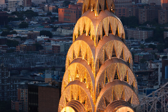 New York City, NY, USA &ndash; August 29, 2018: Close-up aerial view of the Chrysler Building&rsquo;s illuminated stainless steel crown at sunset. Iconic Art Deco skyscraper in Midtown Manhattan skyline