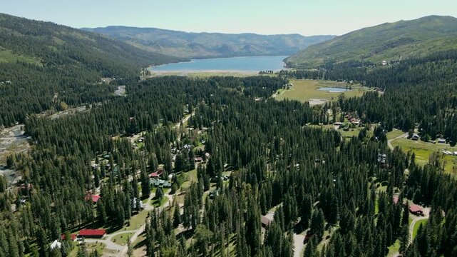 Aerial drone footage of a small village in pine tree area near Vallecito reservoir or Vallecito lake near Durango in southwest Colorado, USA.