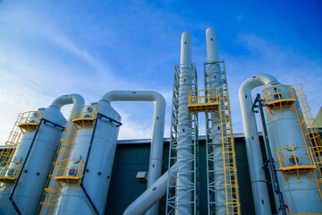 Industrial exhaust air treatment system or wet scrubber system ,Modern industrial plant with a tall...