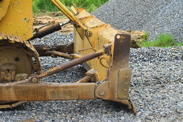 Yelllow Bulldozer Clearing stone in the consternation site