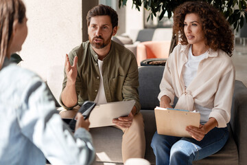 Marketing team discussing new project during informal meeting