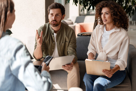 Marketing team discussing new project during informal meeting