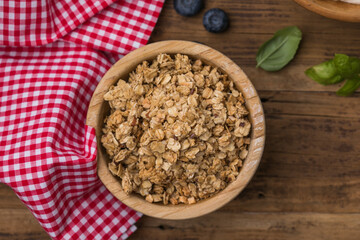 Crunchy dry granola with nuts and seeds. Healthy breakfast cereal mix, perfect for a balanced diet, clean eating, and vegetarian lifestyle.