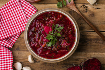 Traditional ukrainian borscht soup with sour cream and fresh herbs