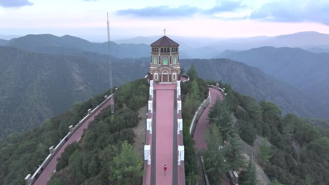 Aerial view of throni church surrounded by majestic mountains and serene landscape, Tsakistra, Nicosia, Cyprus.