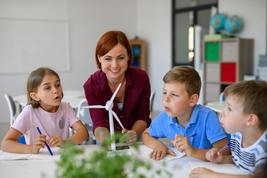 Young children learning about sustainability with teacher in classroom