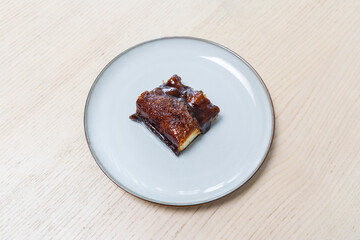 A piece of brown sugar cake on a plate.
