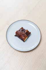 A piece of brown sugar cake on a plate.