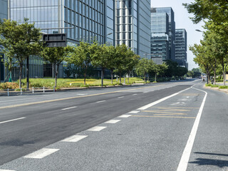 enpty asphalt road with modern office building