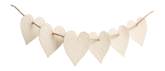 Handmade paper heart garland for hanging across a window in a contemporary studio apartment.