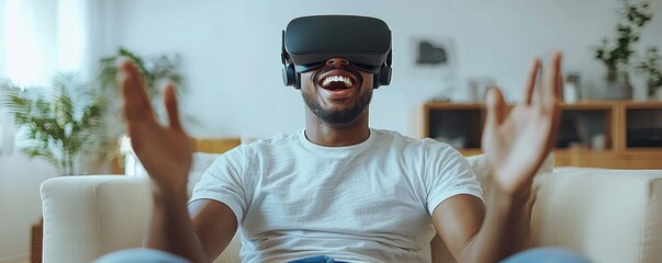 Excited man wearing VR headset and experiencing immersive virtual reality at home