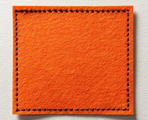 Orange felt square, stitched border