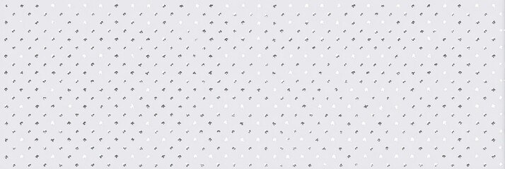 Abstract repeating pattern of small, light gray shapes on a light gray background