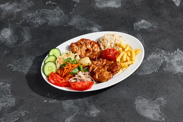 Grilled chicken fillet with vegetables and rice, bright lighting, overhead composition