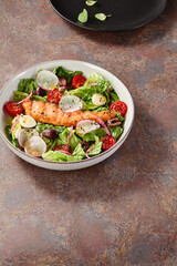 Grilled salmon salad with fresh vegetables, bright lighting, overhead composition