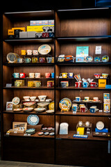 Charming Vintage Tableware Display in a Cozy Shop Setting