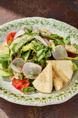 Halloumi cheese salad with fresh vegetables, bright lighting, overhead composition