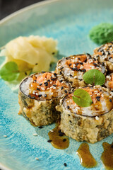 Tempura salmon maki roll with spicy sauce, bright natural lighting, overhead composition
