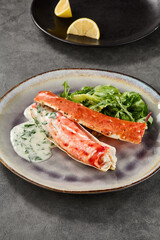 Kamchatka crab phalanges with mixed greens and creamy sauce, bright lighting, overhead composition
