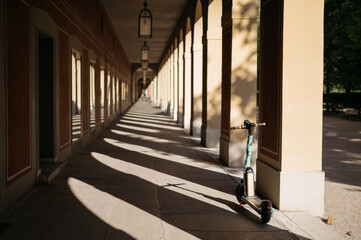 Obraz premium Electric Scooter Parked in Historic Hofgarten Arcade, Munich