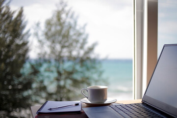 hot cup of coffee on the table in the morning, relaxing time, by the window