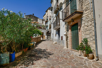 A narrow street among the ancient houses of a medieval village in Abruzzo, Italy.