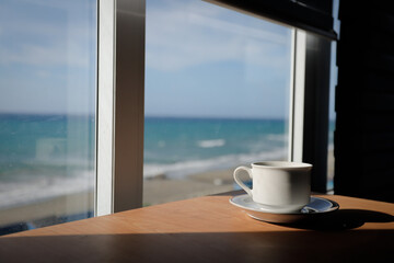 hot cup of coffee on the table in the morning, relaxing time, by the window