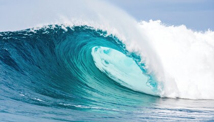 A powerful ocean wave curls majestically under the bright blue sky