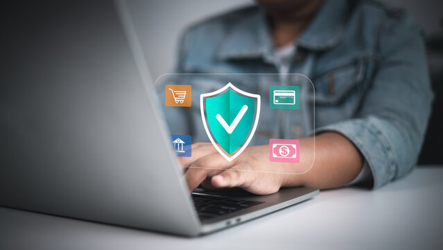 Person using laptop with a security shield and green checkmark, surrounded by shopping, banking, credit card, and money icons, symbolizing safe online transactions and personal data protection.