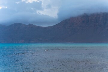 Obraz premium “Natural rugged beach landscape with powerful ocean waves in Lanzarote”
