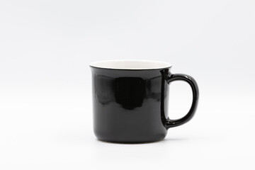 Black and white ceramic mug standing on white background