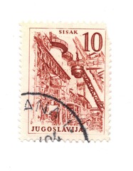 A vintage postage stamp from Yugoslavia isolated on a white background.