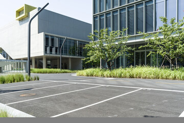 enpty asphalt road with modern office building