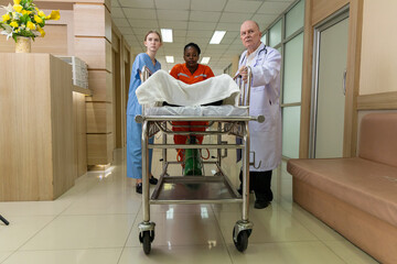 Emergency medical team rushing patient on stretcher