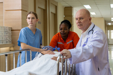 Emergency medical team rushing patient on stretcher