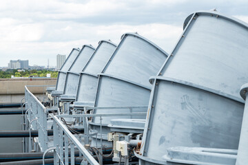 Industrial cooling fans and solar panels on rooftop