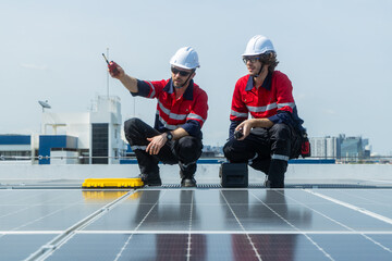 Engineers inspecting rooftop solar panel installation