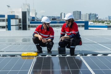 Engineers inspecting rooftop solar panel installation