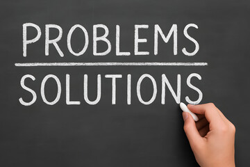 Fototapeta premium Problems and solutions written on chalkboard concept, powerful business mindset illustration symbolizing challenge identification strategic thinking problem solving motivation improvement growth and s