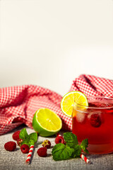 Cold fruit drink with strong color and natural ingredients - close-up of homemade style. Vertical photo, copy space.