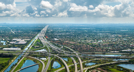 View from above of USA transportation infrastructure. American freeway intersection with fast...