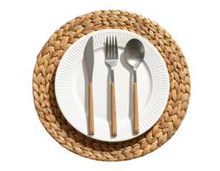 Set of Biodegradable Fork, Knife, and Spoon on White Plate with Woven Placemat, Top-Down View, isolated on transparent background