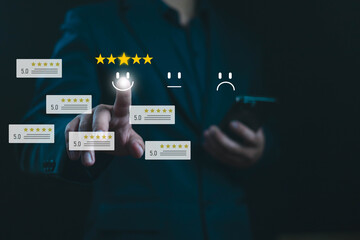 Obraz premium Customer satisfaction survey concept. User give five-star rating to service experience, A man presses phone in front of him,Good service has resulted in 5-star, satisfaction, user, Positive Review