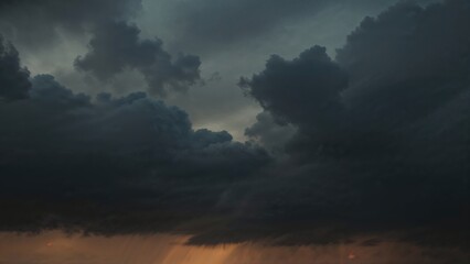 Fototapeta premium Twilight with heavy clouds signaling impending rain. Somber summer sky filled with dark clouds.